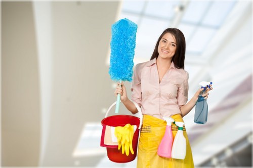 Carpet cleaning team preparing equipment with safety gear in a home